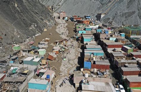 cleaning mud Peru|At Least 12 Confirmed Dead After Mudslides in Peru.